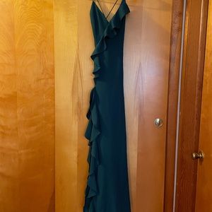 Emerald green floor length dress.